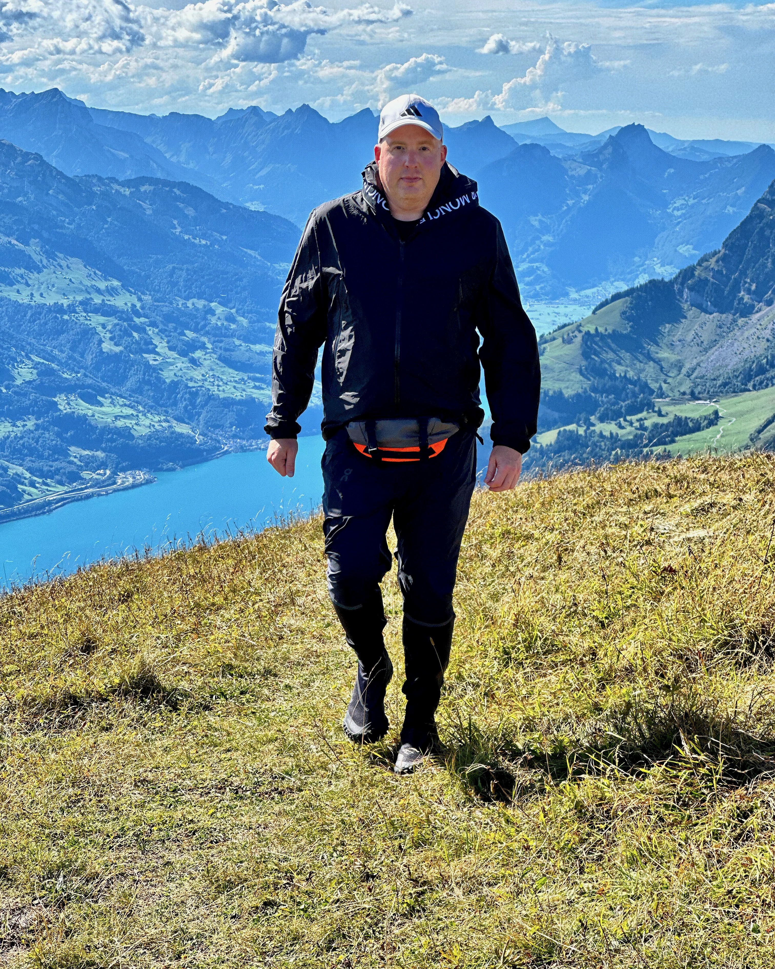 Josh Kerr walking on top of a mountain in Switzerland.